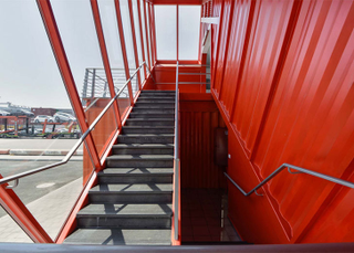 Illustration for article titled Shipping Container Offices Are Right at Home On an Industrial Seafront